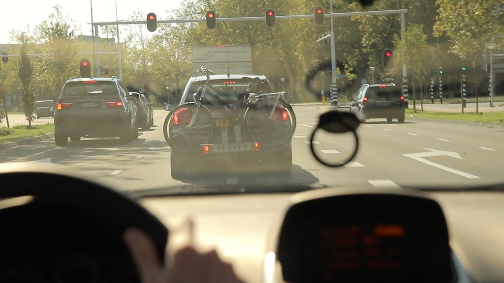 Driving school instructor teaching a student in a car